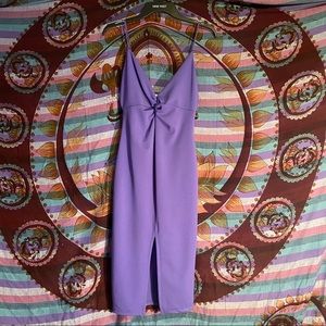 Purple bodycon dress with small slit in the front